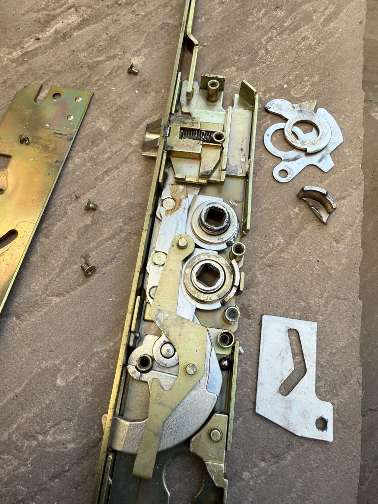 Millenco Mantis multipoint gearbox stripped down for repair on uPVC door in Killingworth by Locksmith Kev