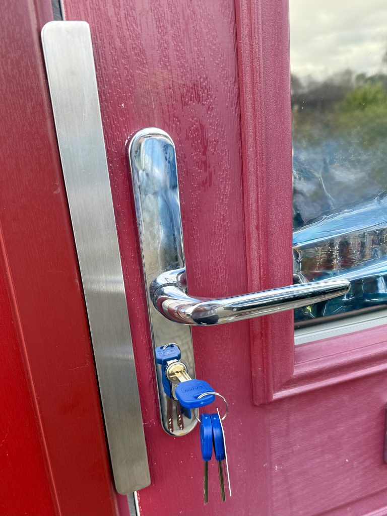 Commercial door security upgrade with inline handles, split spindle system, 3-star Sold Secure Diamond euro cylinder and latch guard installed on outward opening office access door in Newcastle.