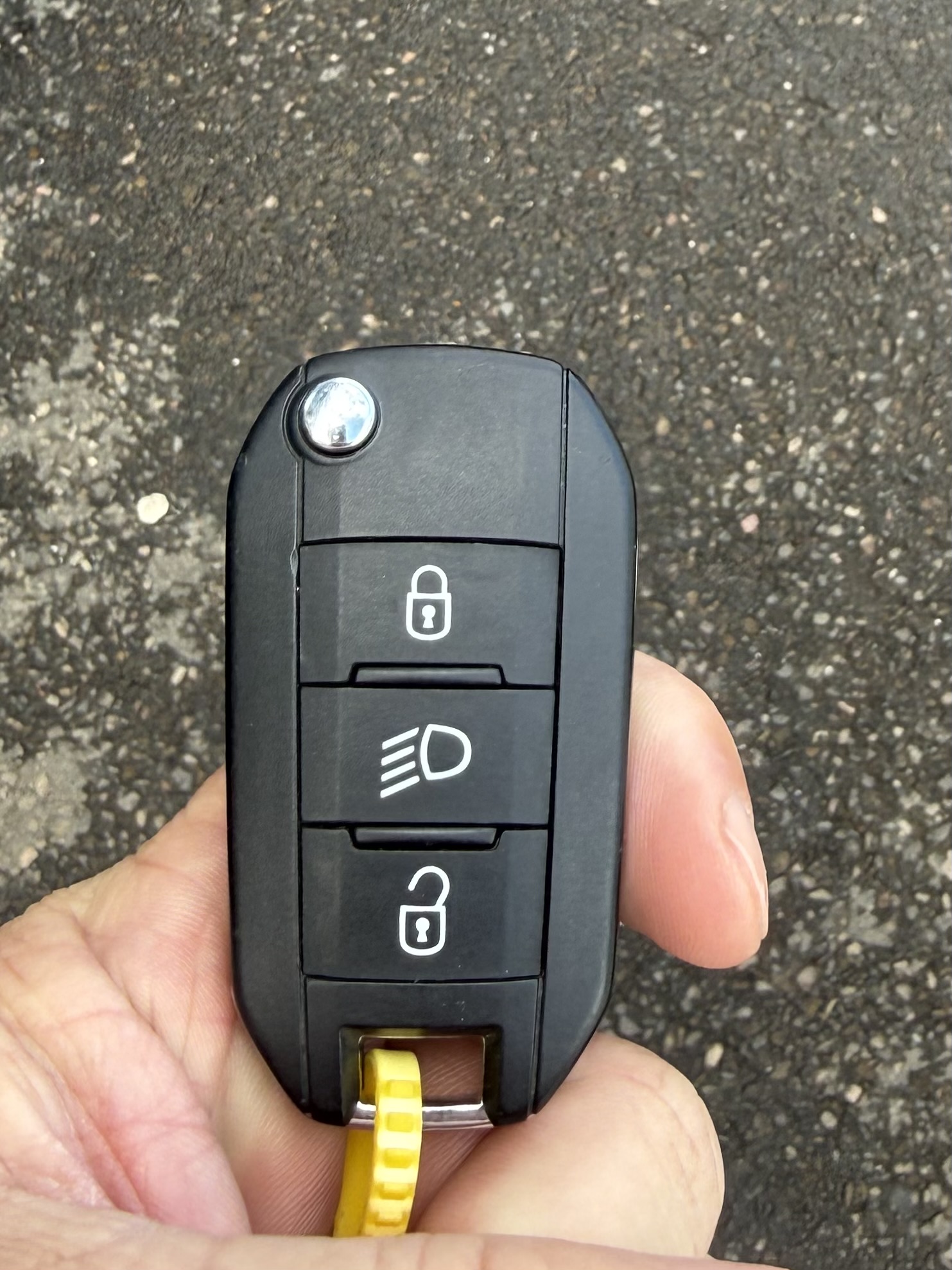 PSA remote key being quality tested for compatibility with Peugeot Citroen and Vauxhall vehicles