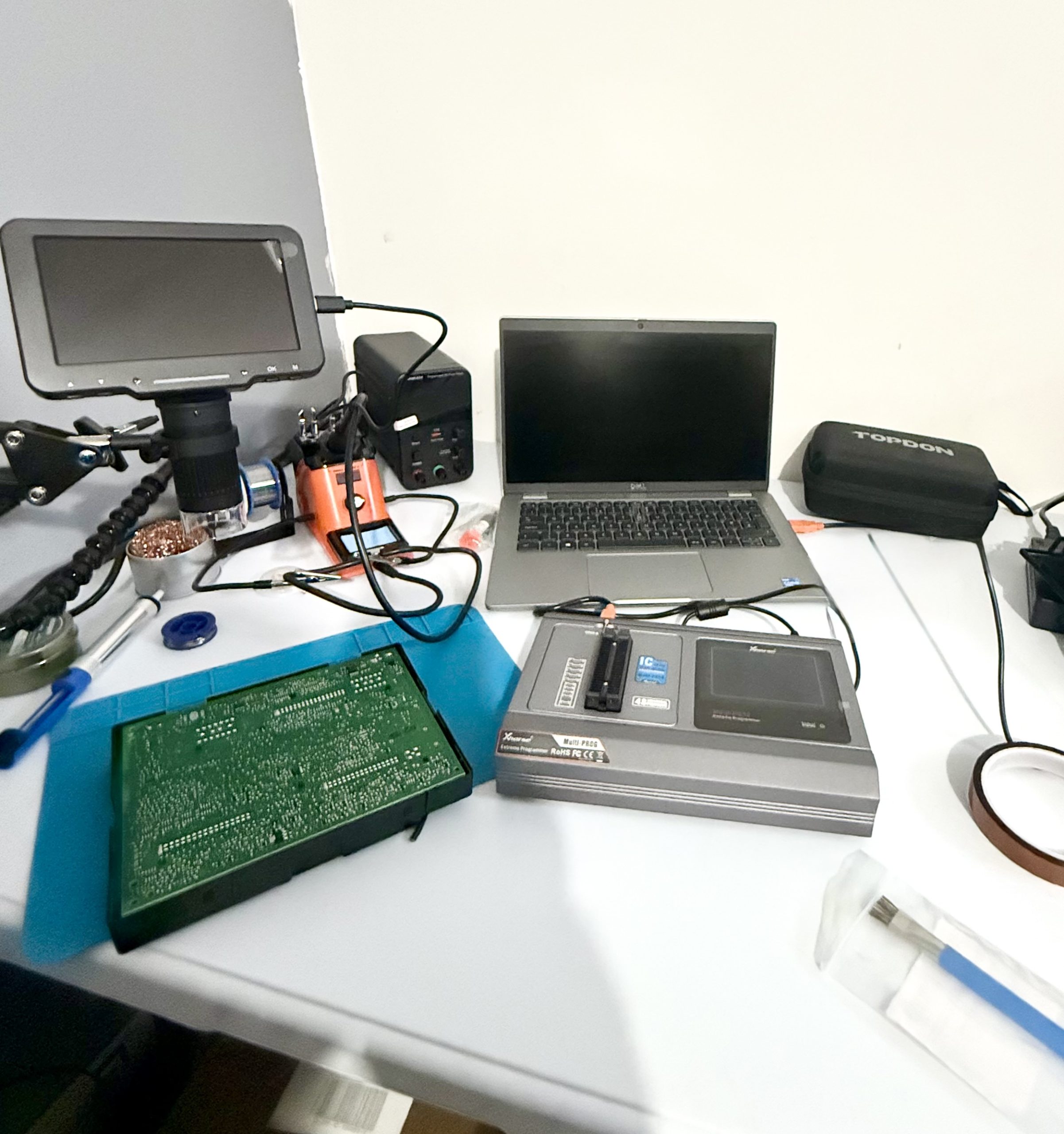 Dedicated auto locksmith workshop in Cramlington with EEPROM programmer digital microscope soldering equipment and diagnostic laptop